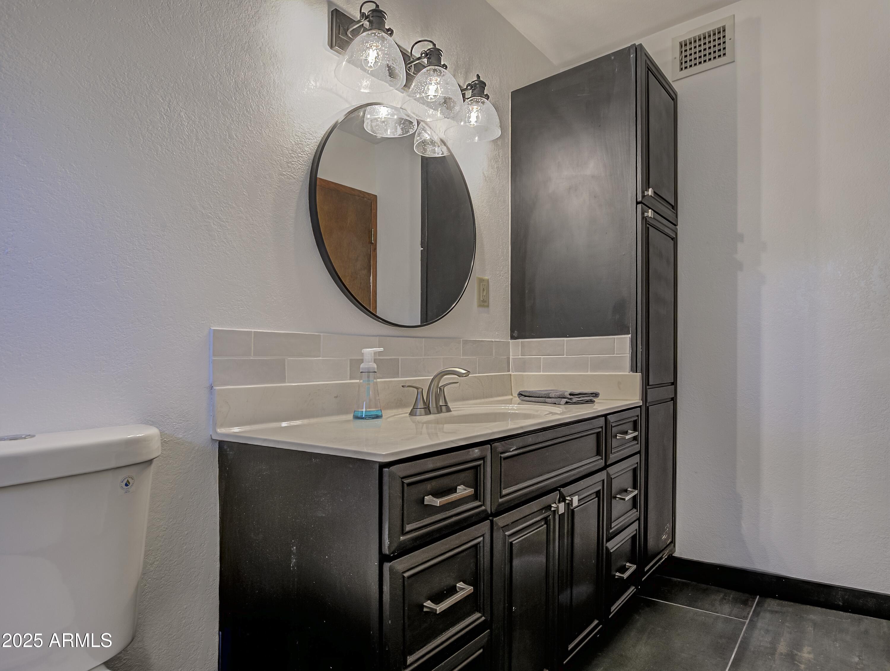 4763 Ernies Road Strawberry, AZ 85544 - Photo 20 of 50 a bathroom with a sink and a mirror