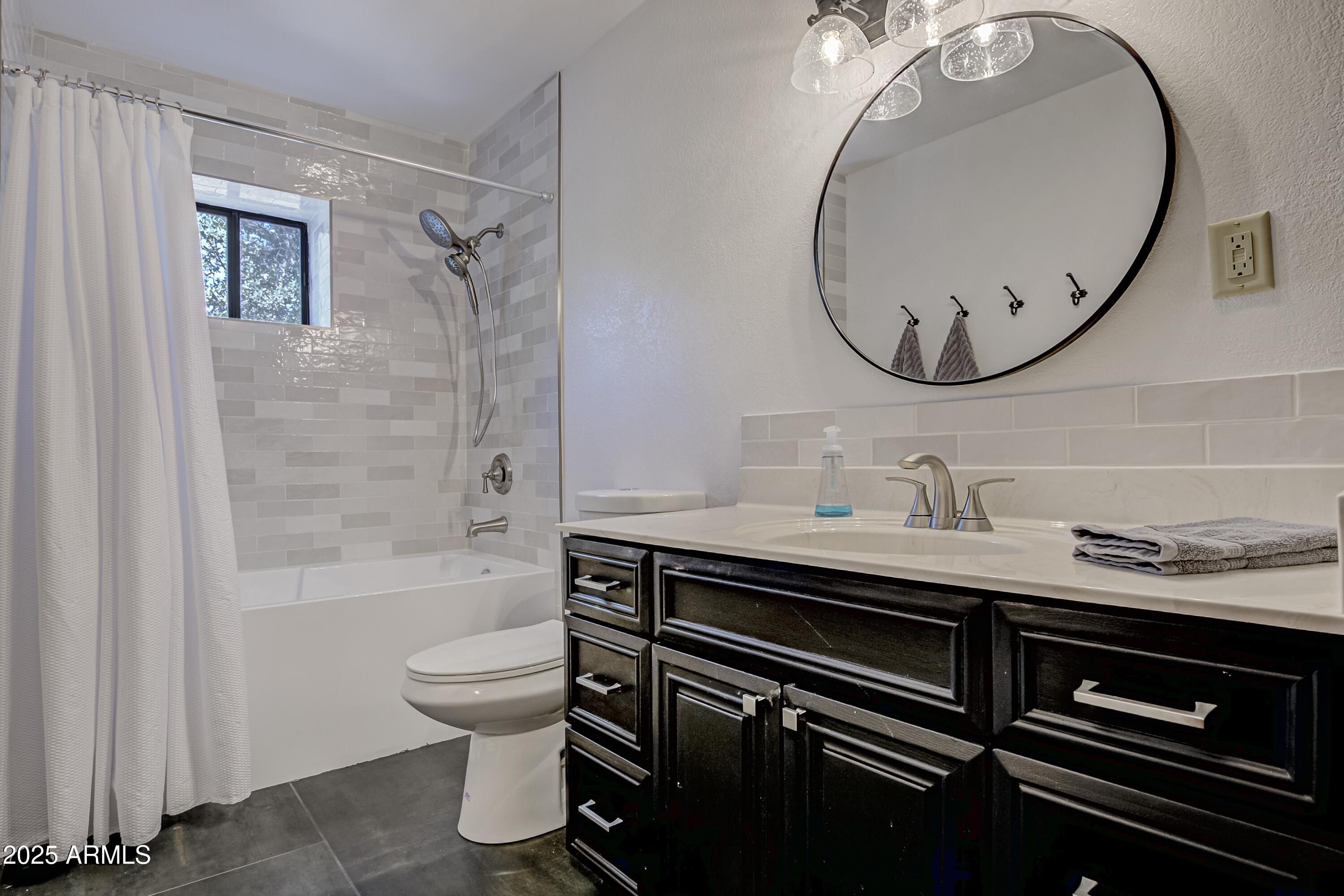 4763 Ernies Road Strawberry, AZ 85544 - Photo 21 of 50 a bathroom with a sink a toilet and a mirror