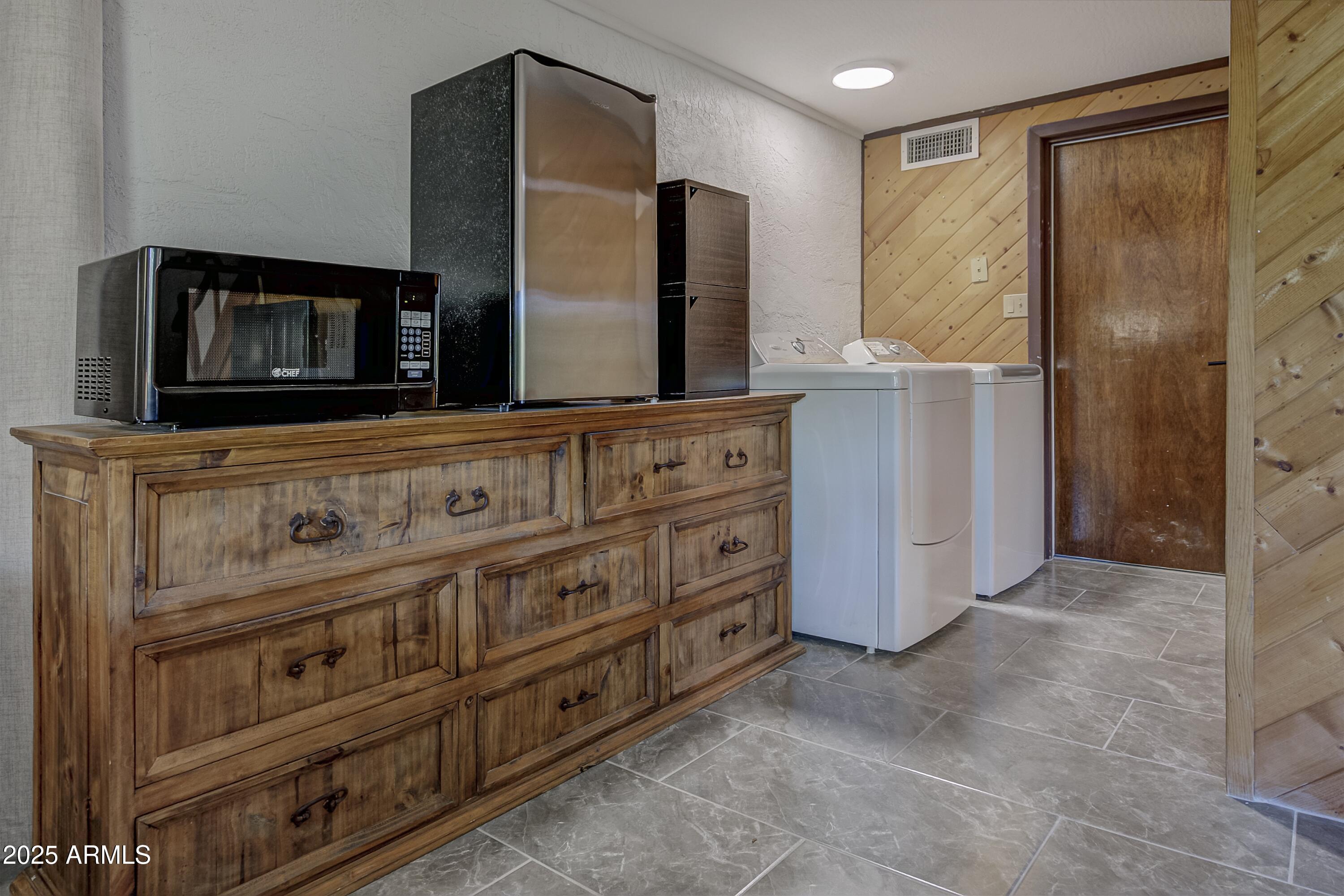 4763 Ernies Road Strawberry, AZ 85544 - Photo 27 of 50 a bathroom with a sink a mirror and a shower