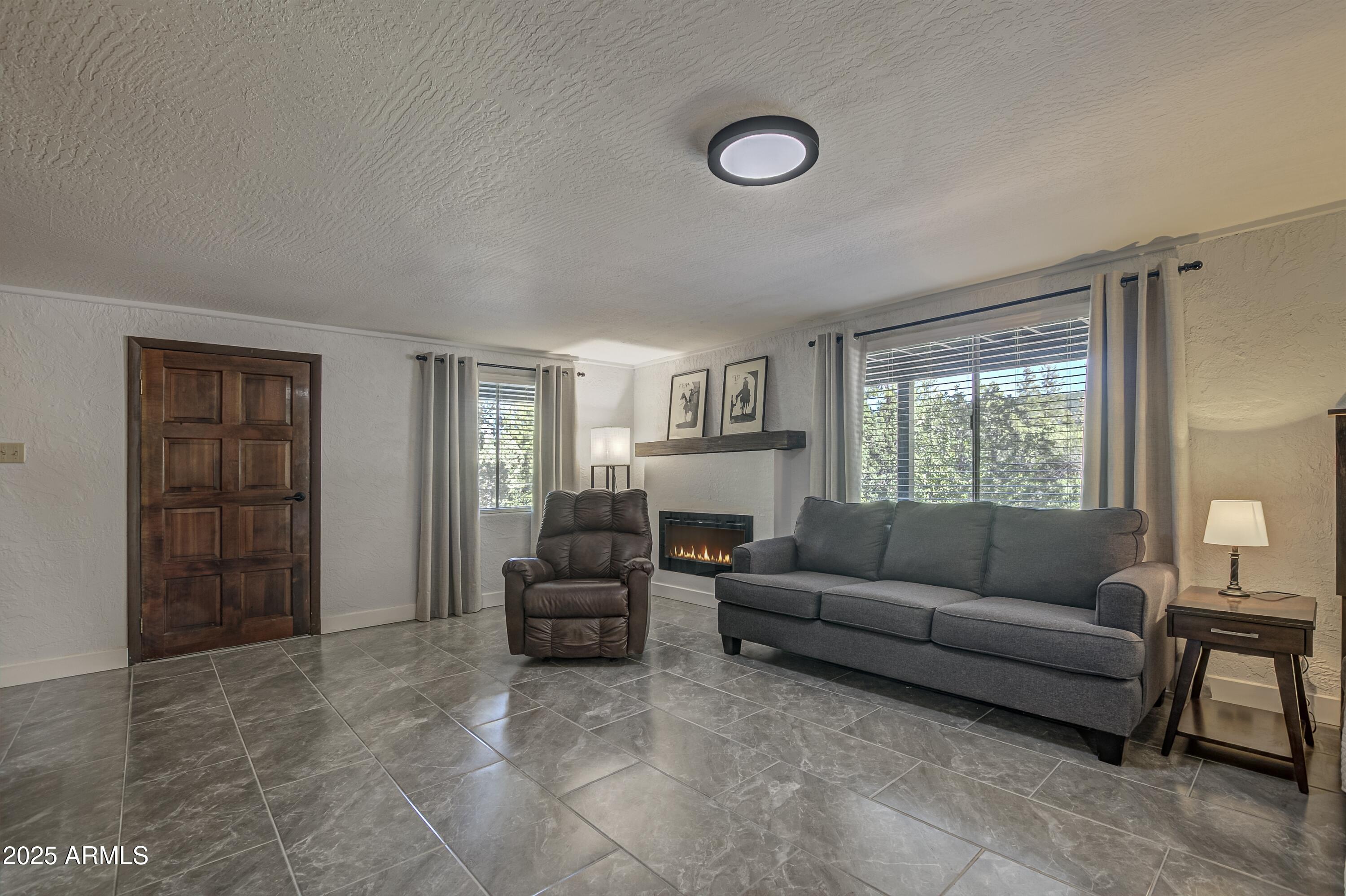 4763 Ernies Road Strawberry, AZ 85544 - Photo 30 of 50 a living room with furniture and a window