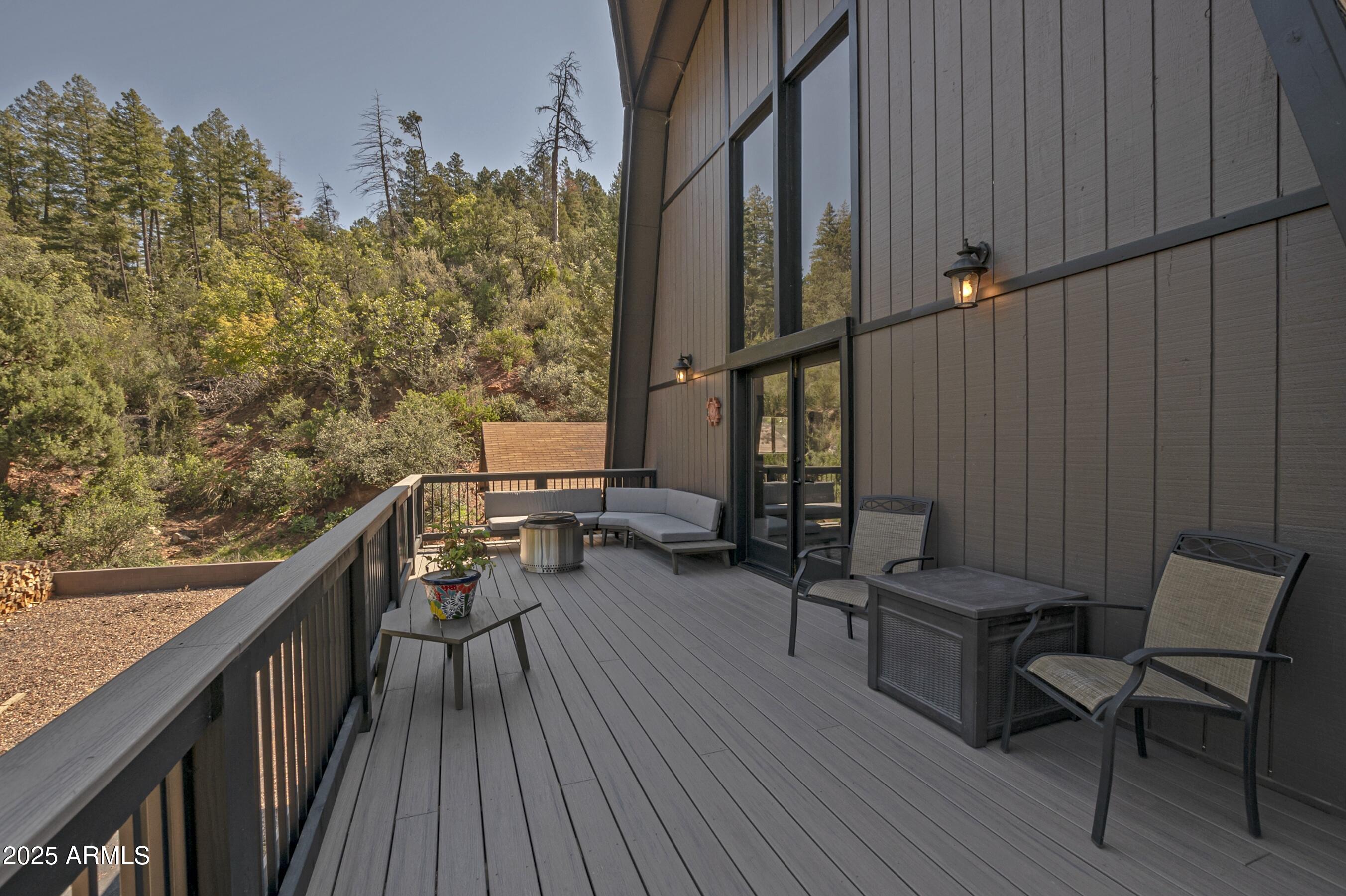 4763 Ernies Road Strawberry, AZ 85544 - Photo 32 of 50 a balcony with wooden floor and furniture