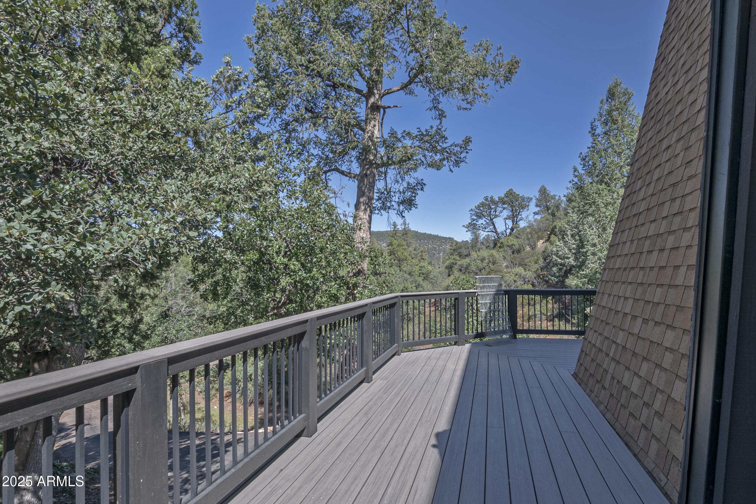 4763 Ernies Road Strawberry, AZ 85544 - Photo 33 of 50 a view of balcony with wooden floor and fence