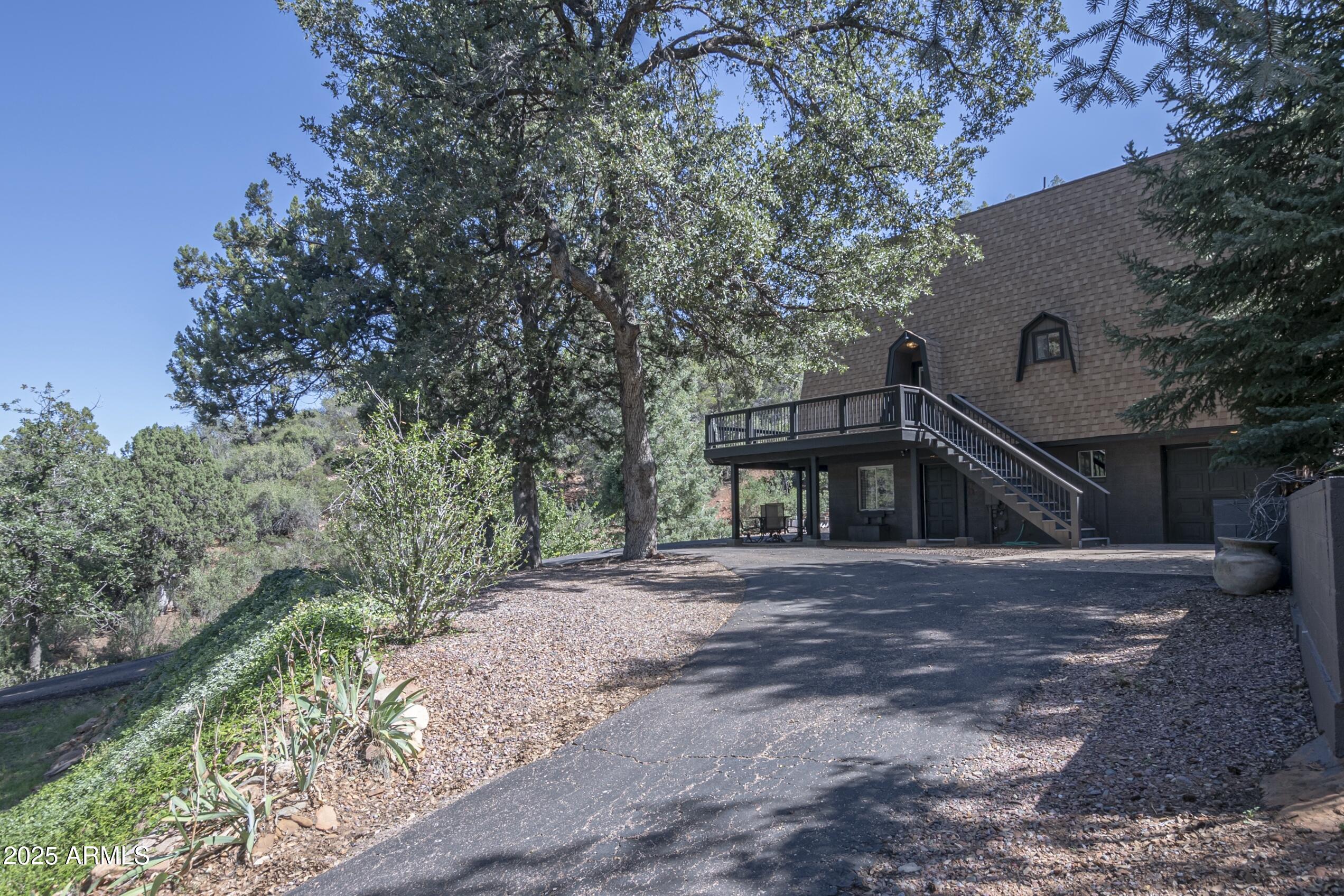 4763 Ernies Road Strawberry, AZ 85544 - Photo 39 of 50 a front view of a house with a yard and garage