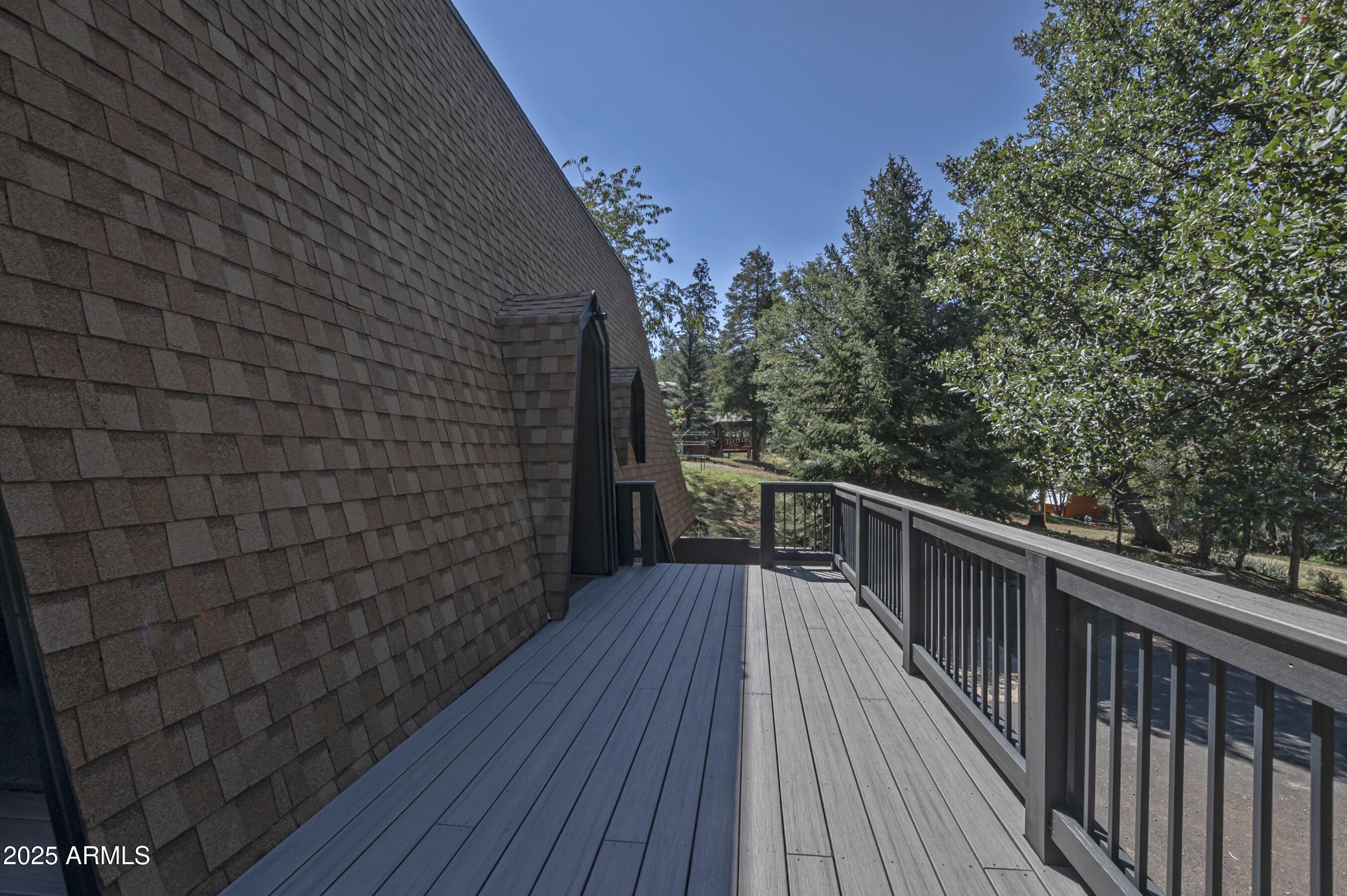 4763 Ernies Road Strawberry, AZ 85544 - Photo 47 of 50 a view of balcony with wooden floor and fence