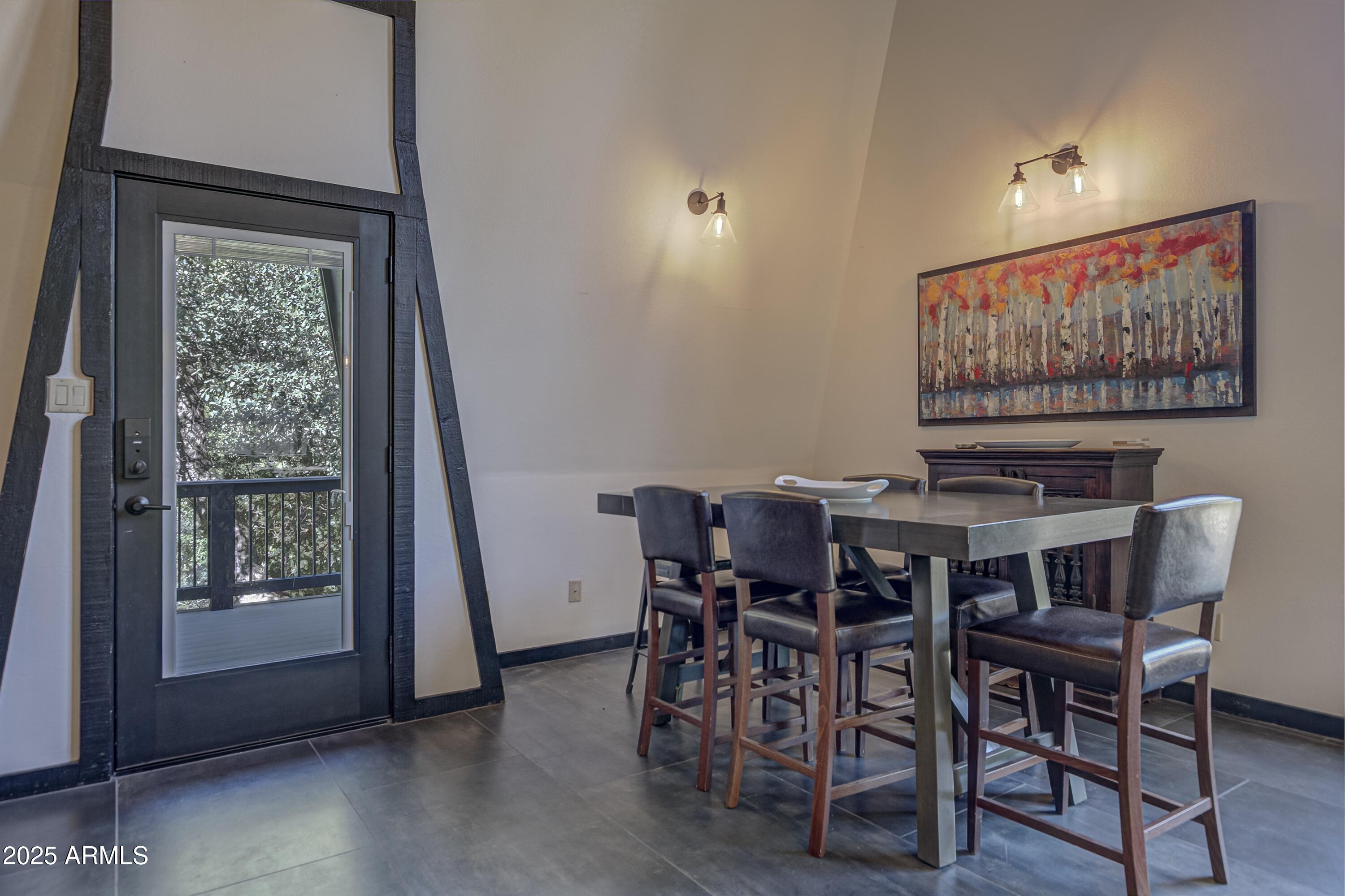 4763 Ernies Road Strawberry, AZ 85544 - Photo 6 of 50 a view of a dining room with furniture window and wooden floor
