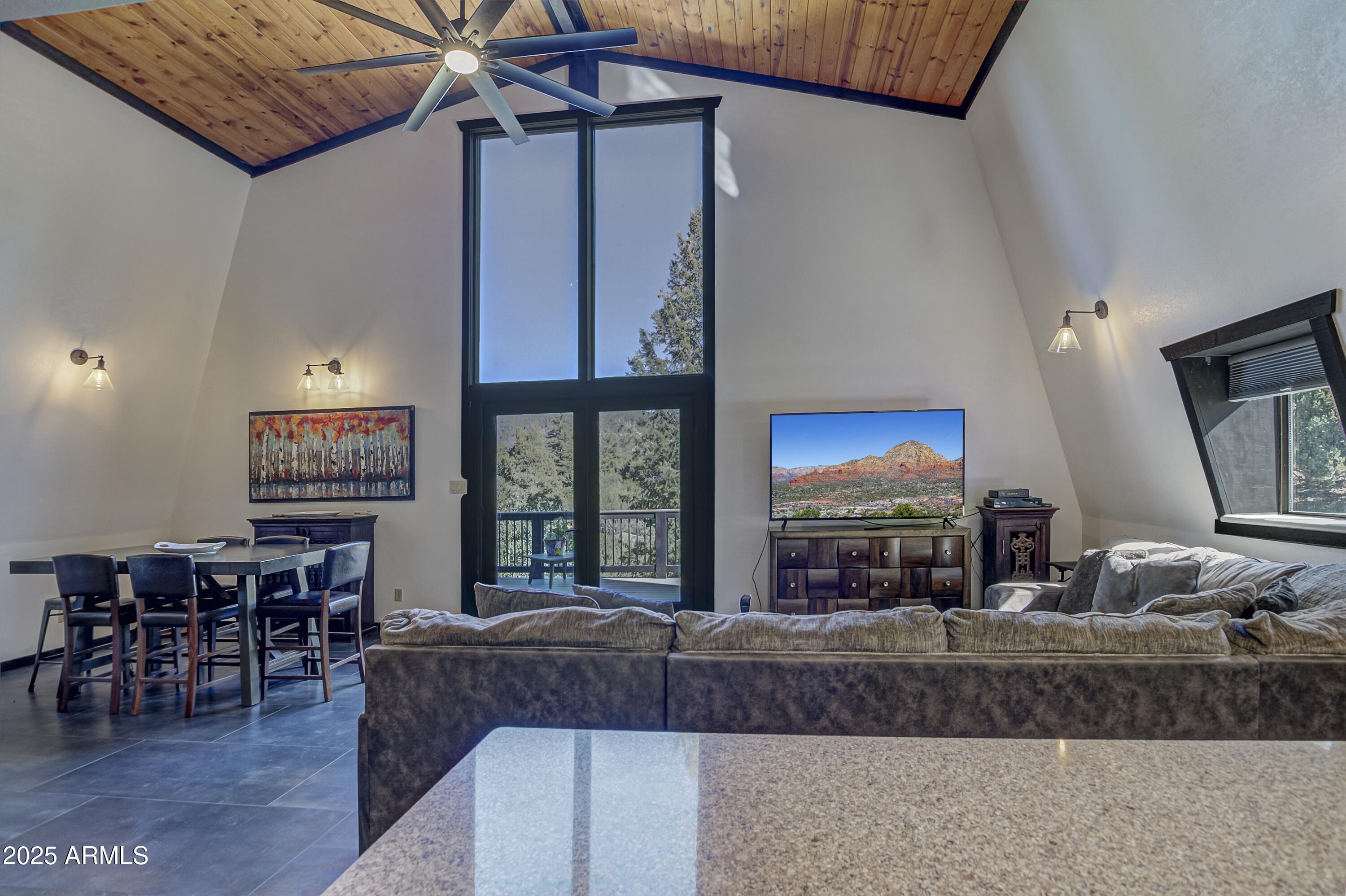 4763 Ernies Road Strawberry, AZ 85544 - Photo 7 of 50 a living room with furniture a window and kitchen view