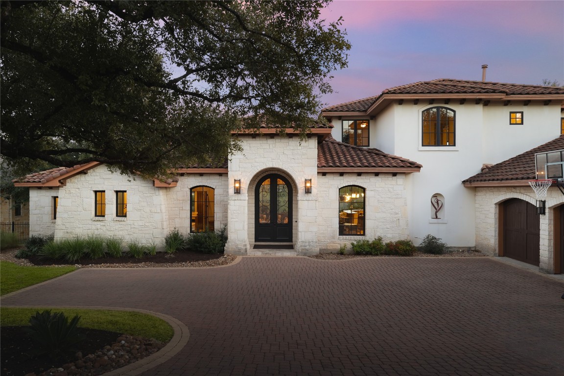 a front view of a house with garden