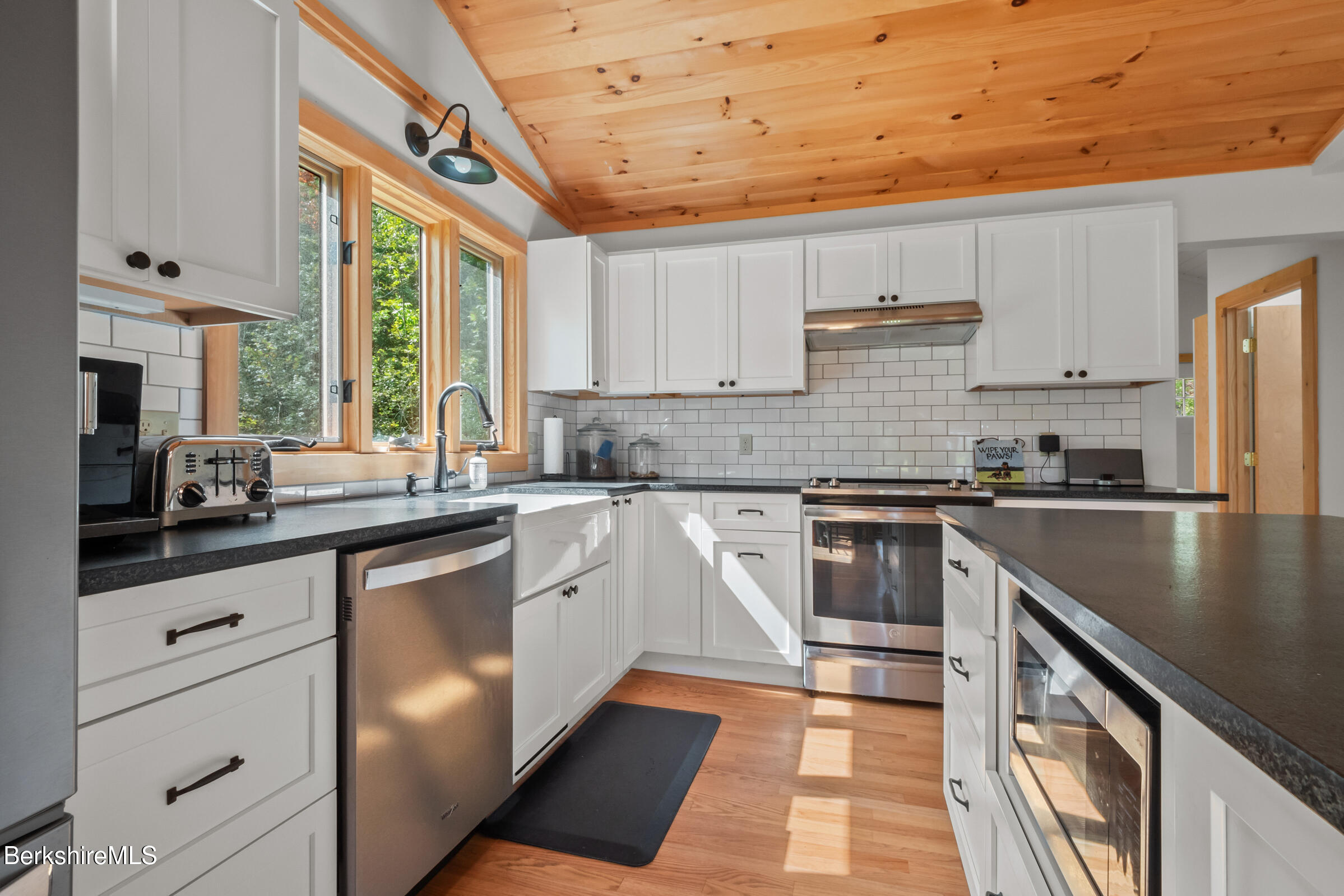 10 Phelps Road Monterey, MA 01245 - Photo 16 of 45 a kitchen with granite countertop a sink stainless steel appliances and cabinets