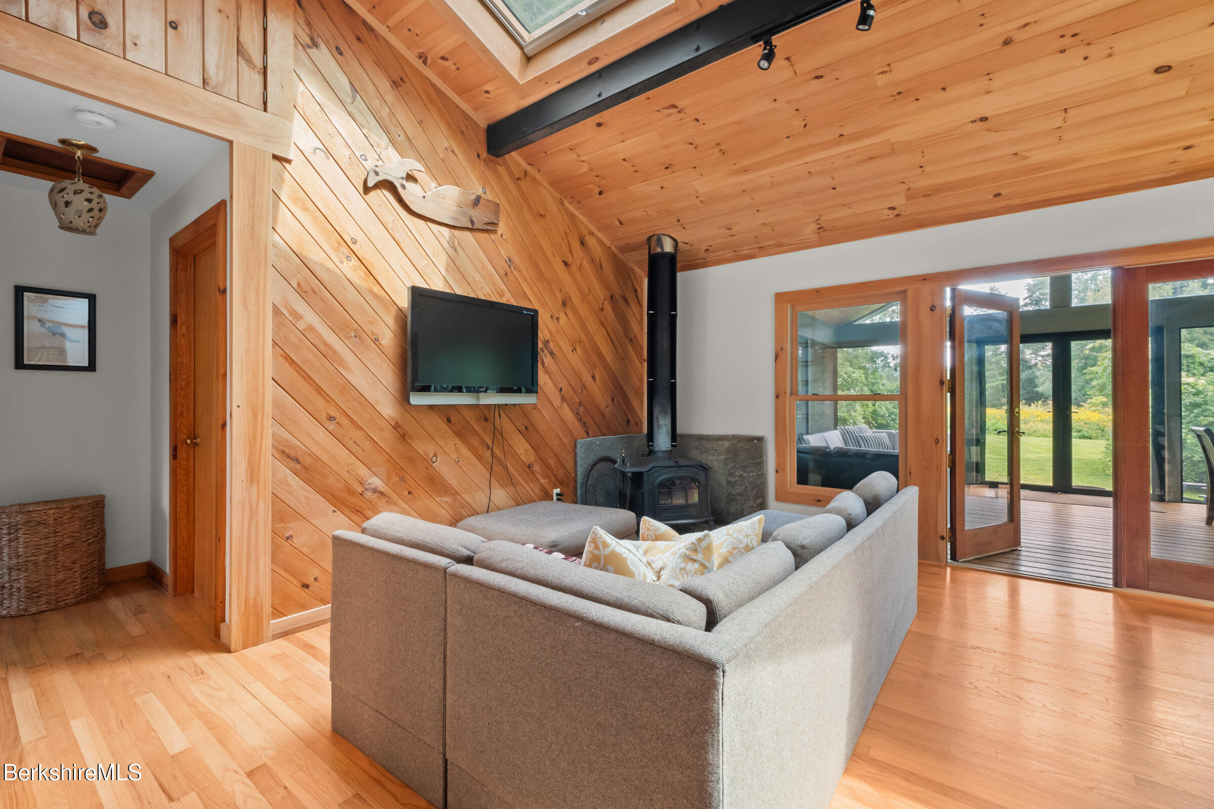 10 Phelps Road Monterey, MA 01245 - Photo 22 of 45 a view of living room kitchen with furniture and flat screen tv