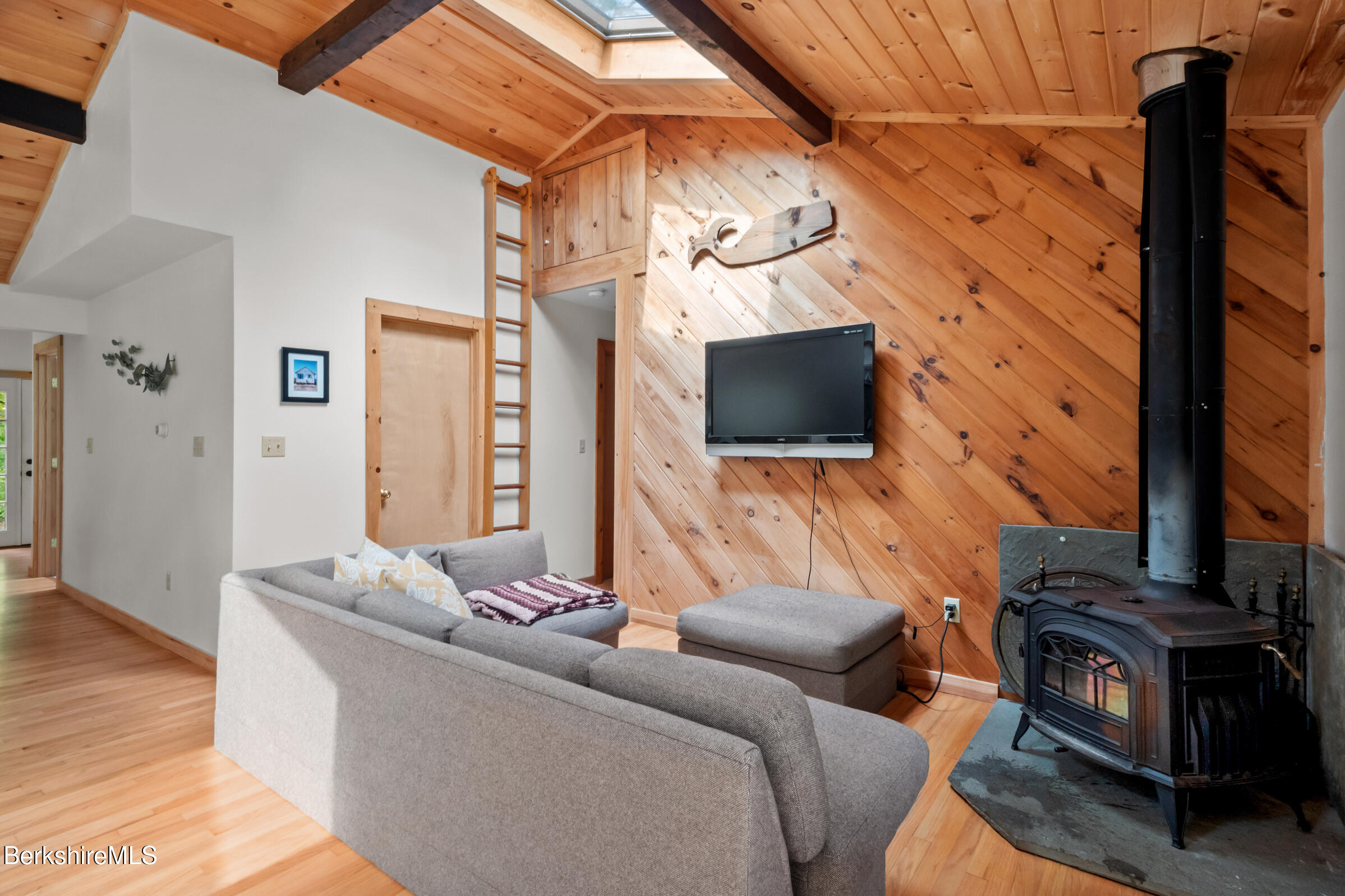 10 Phelps Road Monterey, MA 01245 - Photo 23 of 45 a living room with furniture and a flat screen tv