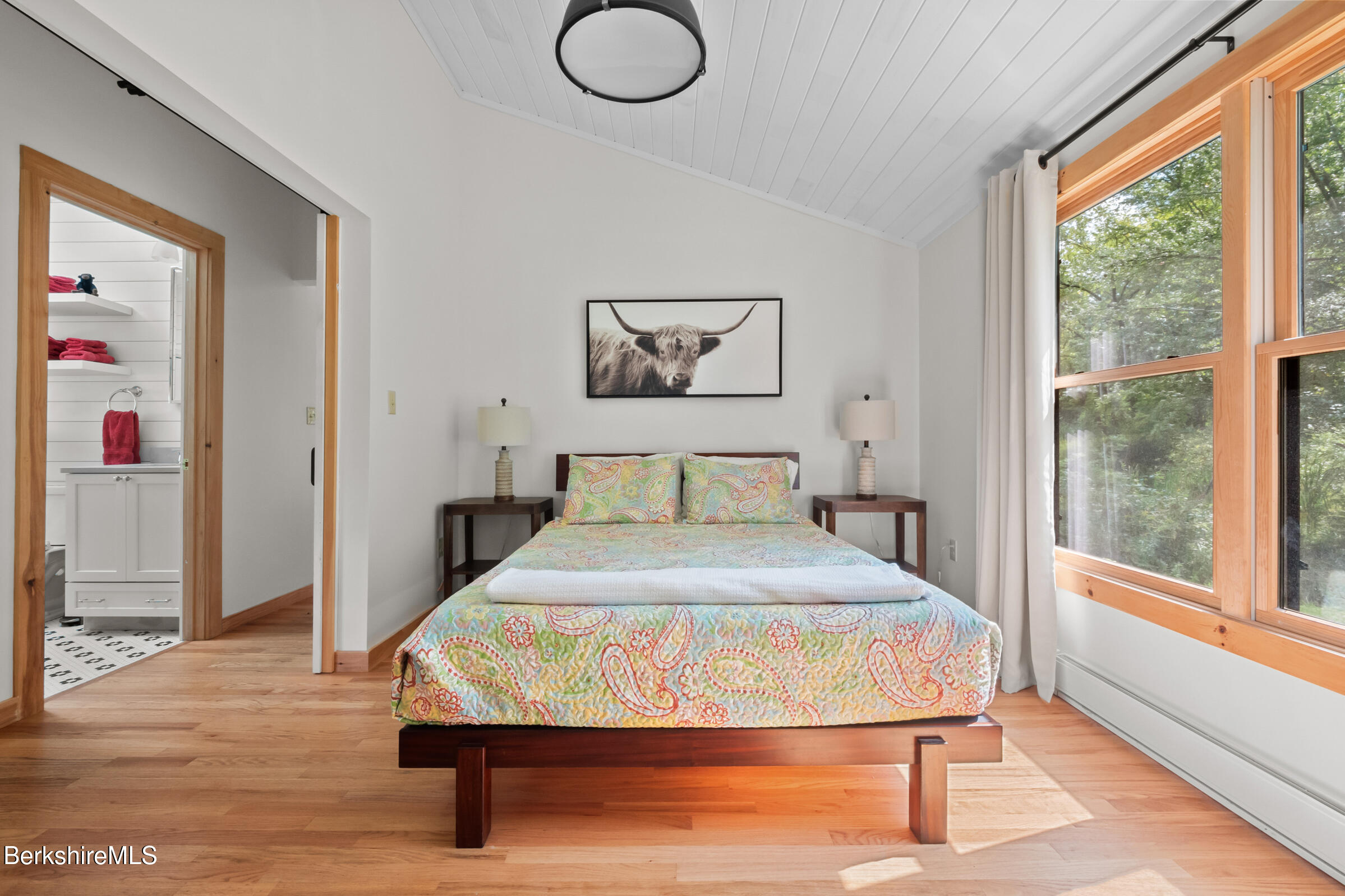 10 Phelps Road Monterey, MA 01245 - Photo 31 of 45 a bedroom with a bed and wooden floor