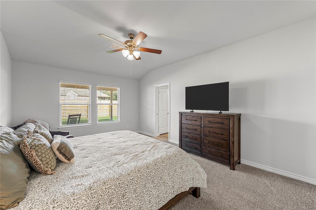 10761 Chesson Flts Drive Waco, TX 76708 - Photo 22 of 30 a bedroom with a bed and a flat screen tv