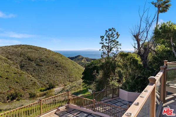 a balcony with an ocean view