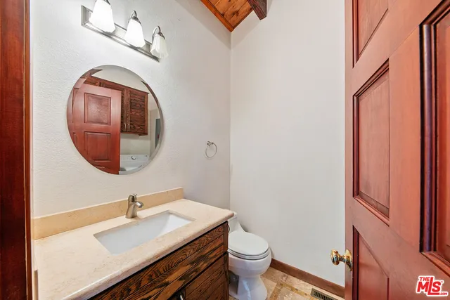 a view of balcony with wooden floor and outdoor seating