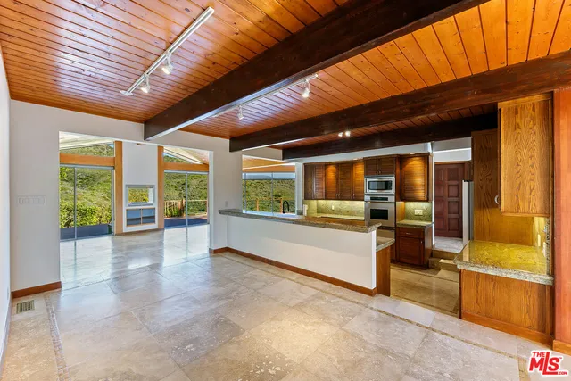 a large kitchen with a large window