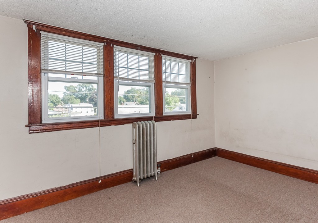 110 Hood Street Springfield, MA 01109 - Photo 13 of 17 an empty room with a window