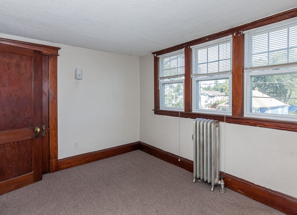 110 Hood Street Springfield, MA 01109 - Photo 14 of 17 an empty room with windows