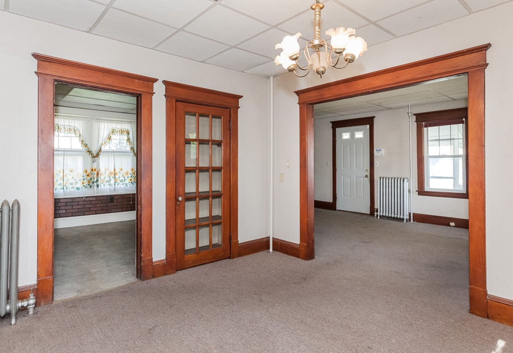 110 Hood Street Springfield, MA 01109 - Photo 9 of 17 a view of an empty room with a window