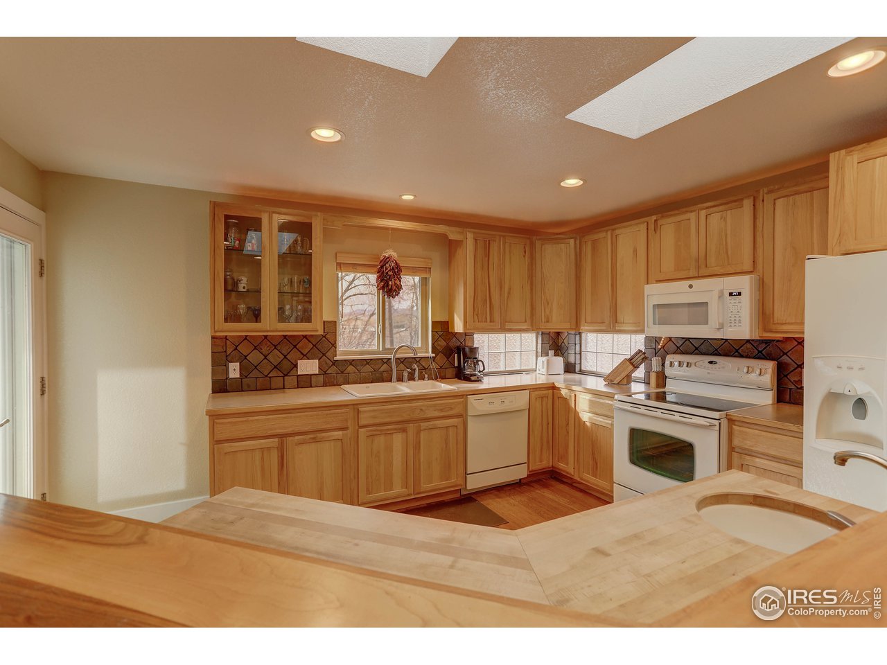 3635 Terry Ridge Road Fort Collins, CO 80524 - Photo 3 of 21 Large butcherblock island with second sink (vegetable).