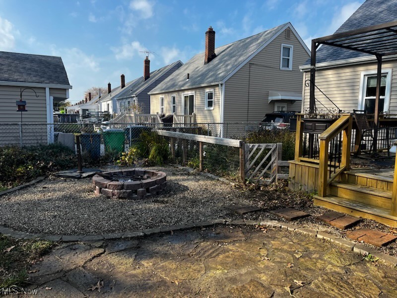 30824 Clarmont Road Willowick, OH 44095 - Photo 2 of 24 Rear view of property with a fire pit