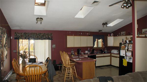 160 Cornell Road Tiverton, RI 02878 - Photo 8 of 21 a kitchen with a table chairs stove and cabinets