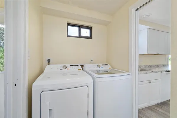 a white toilet sitting next to a shower