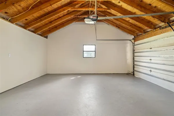 a view of a house with a small yard and plants