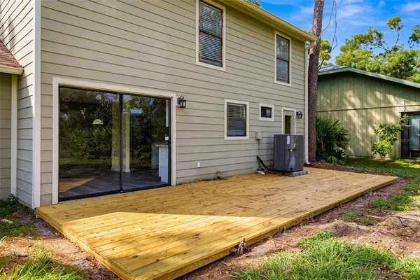 a view of backyard with patio