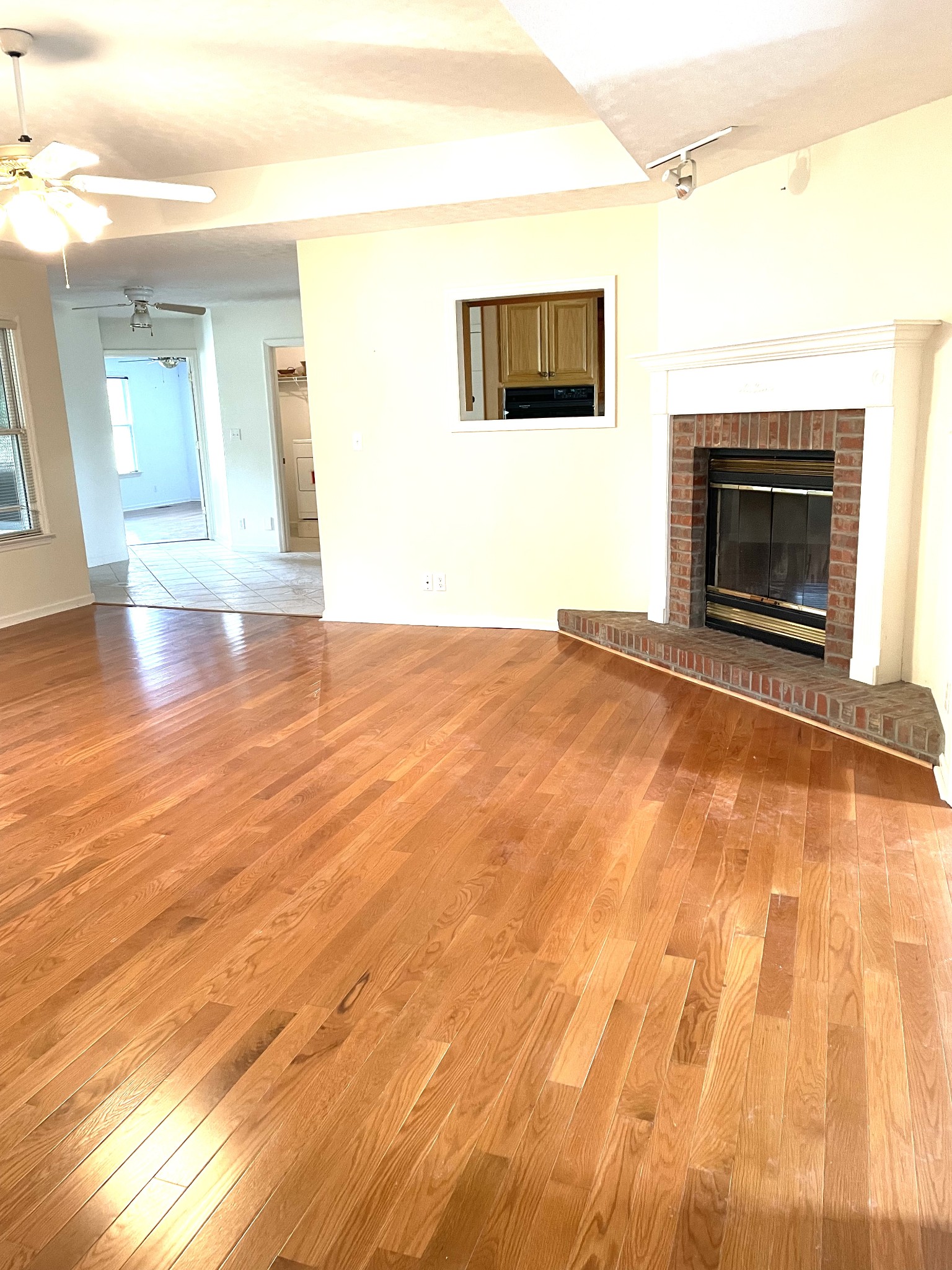 7263 Bidwell Road Joelton, TN 37080 - Photo 4 of 42 Living Room w/Fireplace into Kitchen and toward Master Suite