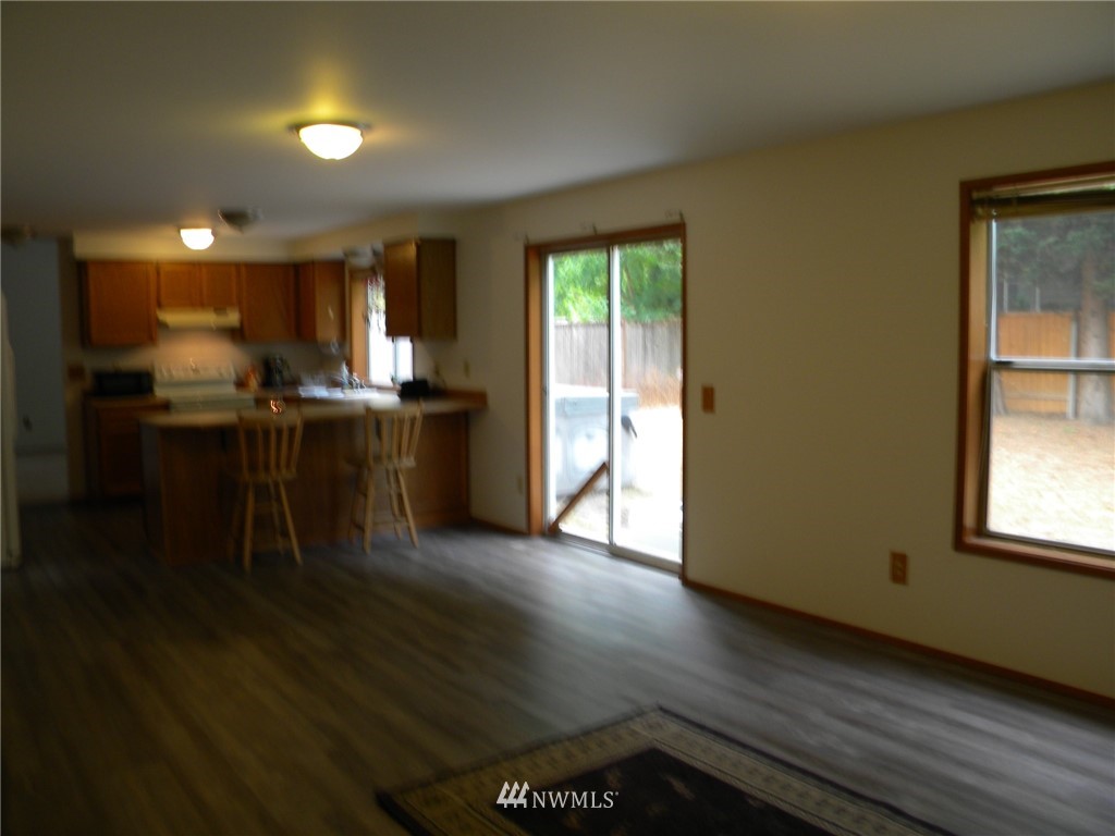3107 164th Place Southeast Bothell, WA 98012 - Photo 11 of 20 a kitchen with stainless steel appliances granite countertop a stove and a refrigerator