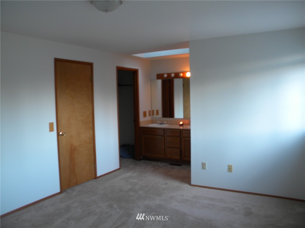 3107 164th Place Southeast Bothell, WA 98012 - Photo 18 of 20 an empty room with a kitchen and a sink