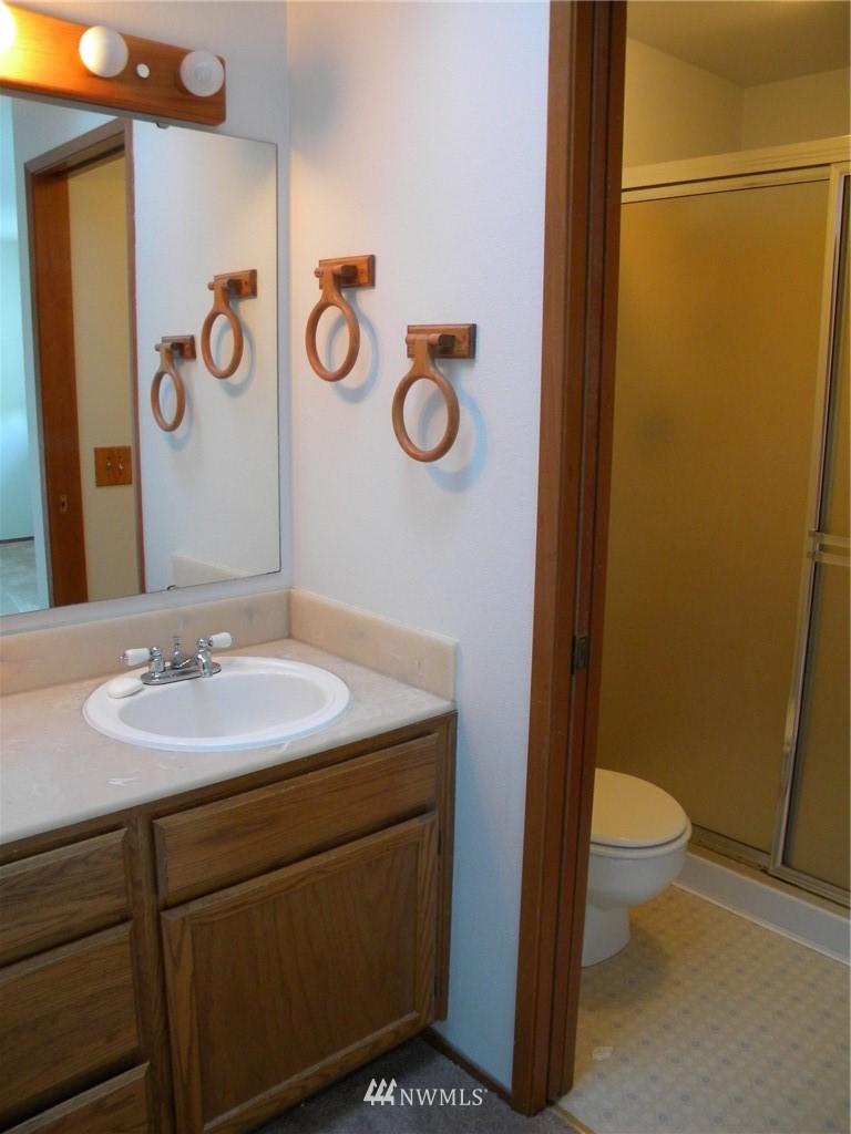 3107 164th Place Southeast Bothell, WA 98012 - Photo 19 of 20 a bathroom with a toilet sink and mirror