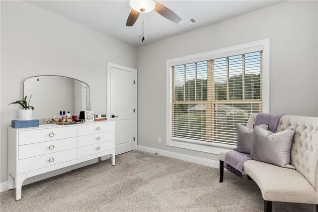 a bedroom with furniture and windows