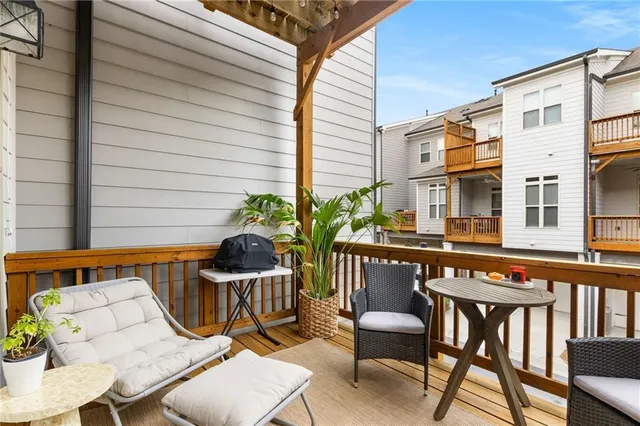 a view of a chairs and table in patio