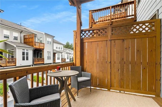 a view of a balcony with furniture and chandelier