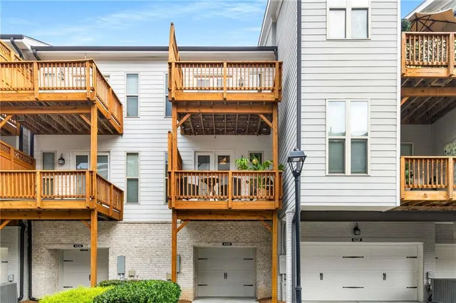 a front view of a house with large windows