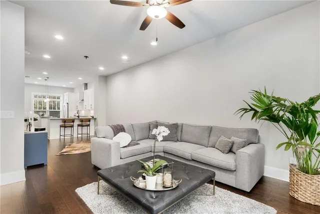 a living room with furniture and a large window