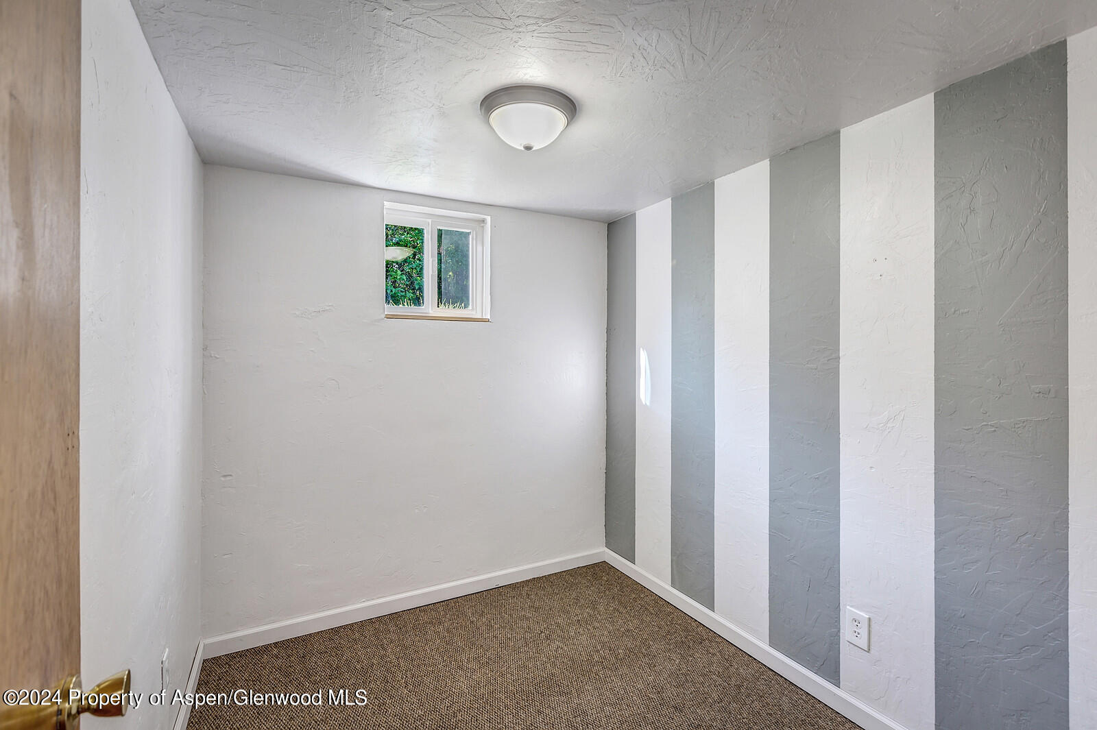 902 Randolph Avenue Rifle, CO 81650 - Photo 12 of 18 a view of an empty room with a window