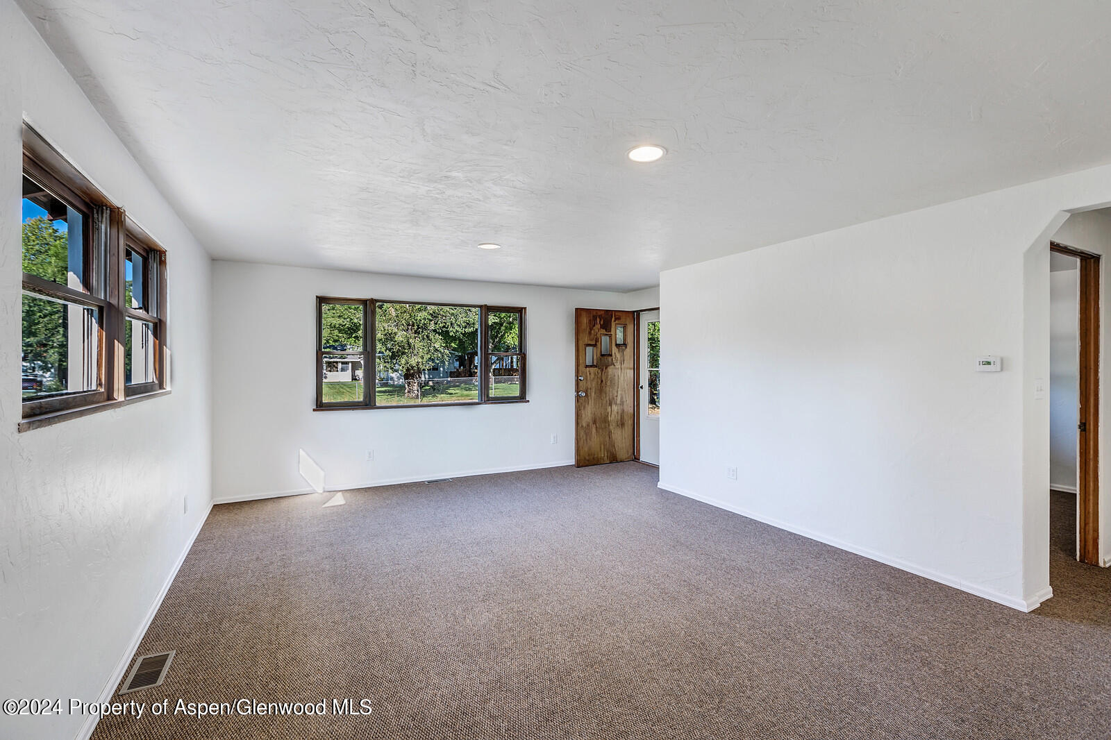 902 Randolph Avenue Rifle, CO 81650 - Photo 4 of 18 a view of an empty room with a window