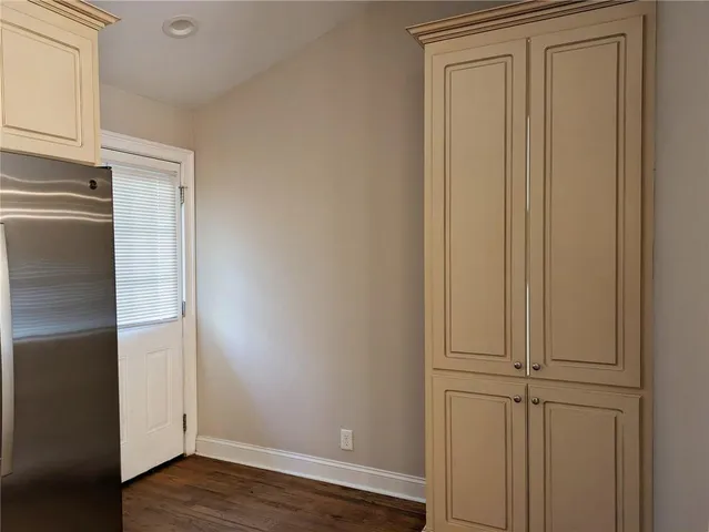 a view of front door with wooden floor