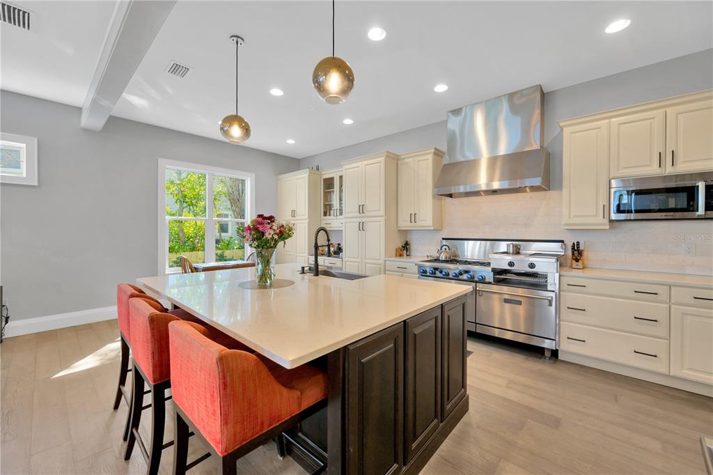 2802 Northpointe Lane Tampa, FL 33611 - Photo 11 of 55 a kitchen with a stove a sink and a refrigerator
