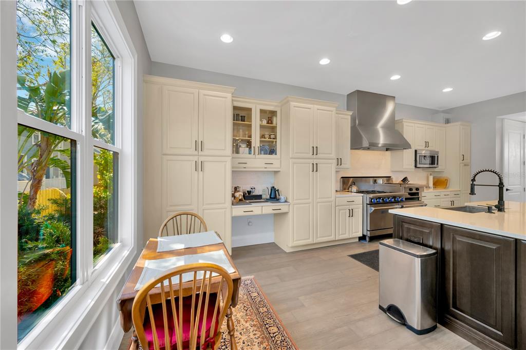 2802 Northpointe Lane Tampa, FL 33611 - Photo 13 of 55 a kitchen with stainless steel appliances granite countertop a stove and a sink