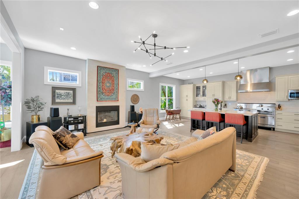 2802 Northpointe Lane Tampa, FL 33611 - Photo 15 of 55 a living room with fireplace furniture and a fireplace