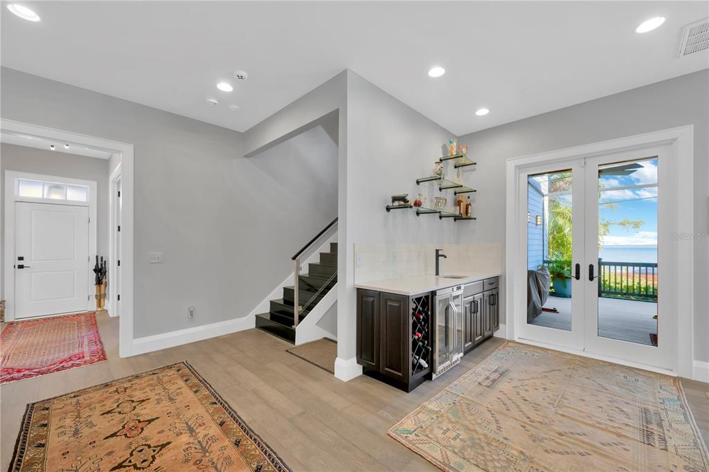 2802 Northpointe Lane Tampa, FL 33611 - Photo 17 of 55 a living room with stainless steel appliances kitchen island granite countertop furniture and a rug