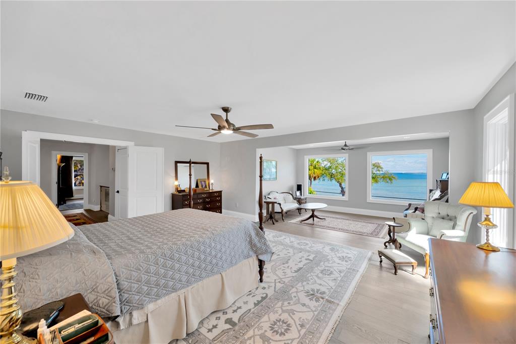 2802 Northpointe Lane Tampa, FL 33611 - Photo 20 of 55 a bedroom with a bed lamps and chairs