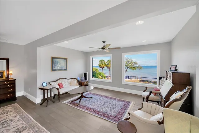 a bathroom with a sink and mirror with bathtub