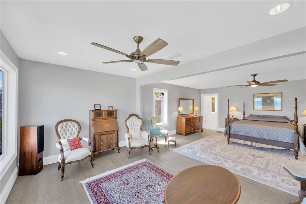 2802 Northpointe Lane Tampa, FL 33611 - Photo 22 of 55 a living room with furniture a window and a clock