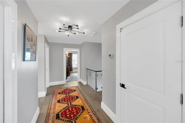 a bedroom with a bed window and table in it