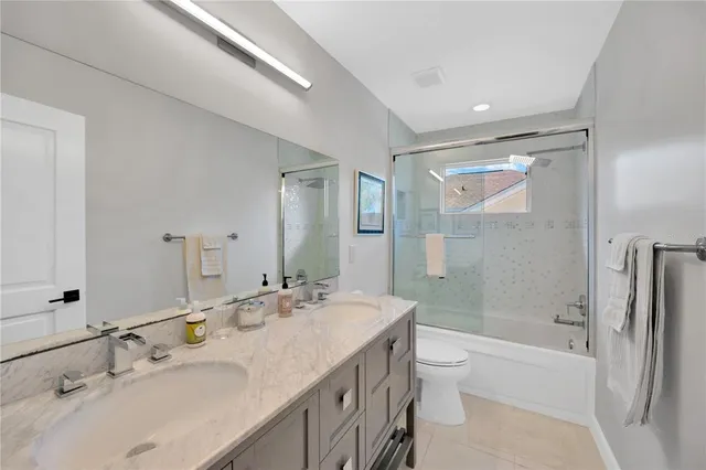 a bedroom with furniture and a rug