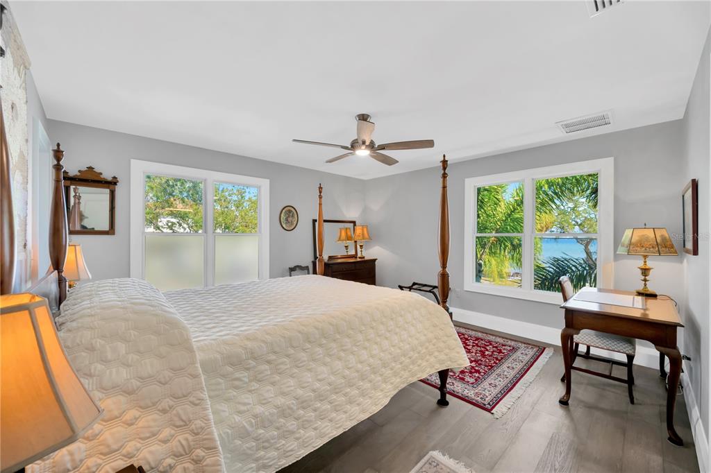 2802 Northpointe Lane Tampa, FL 33611 - Photo 32 of 55 a bedroom with a bed window and table in it